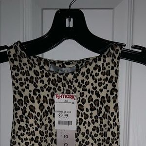 Leopard sleeveless bodysuit with snap crotch.